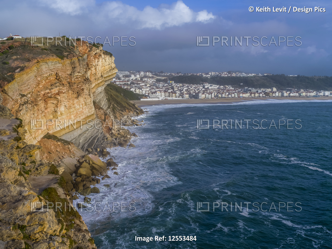 Rugged cliffs and beach along the coastline of Nazare, Portugal, the seaside ...