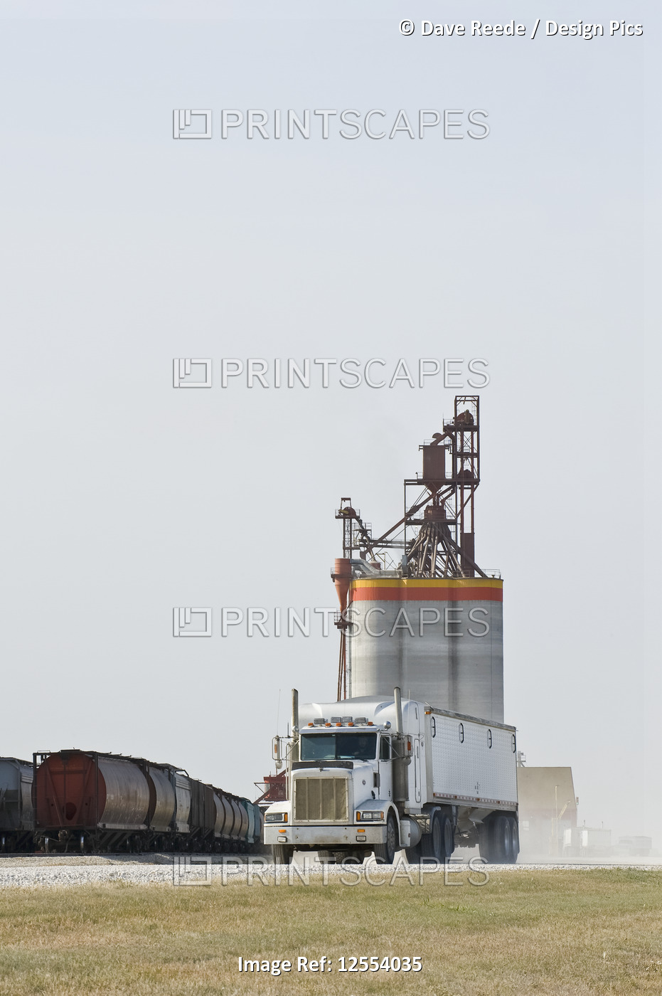 Truck leaving after hauling grain to an inland terminal, near Brunkild; ...