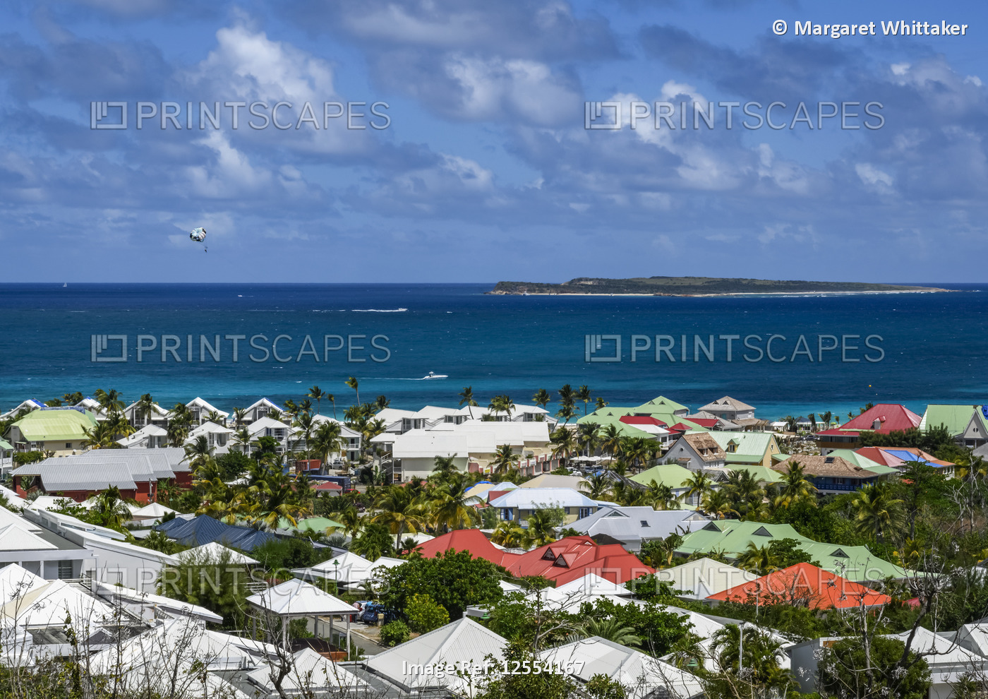 Colourful house rooftops looking out to sea on the island of St. Maarten; ...