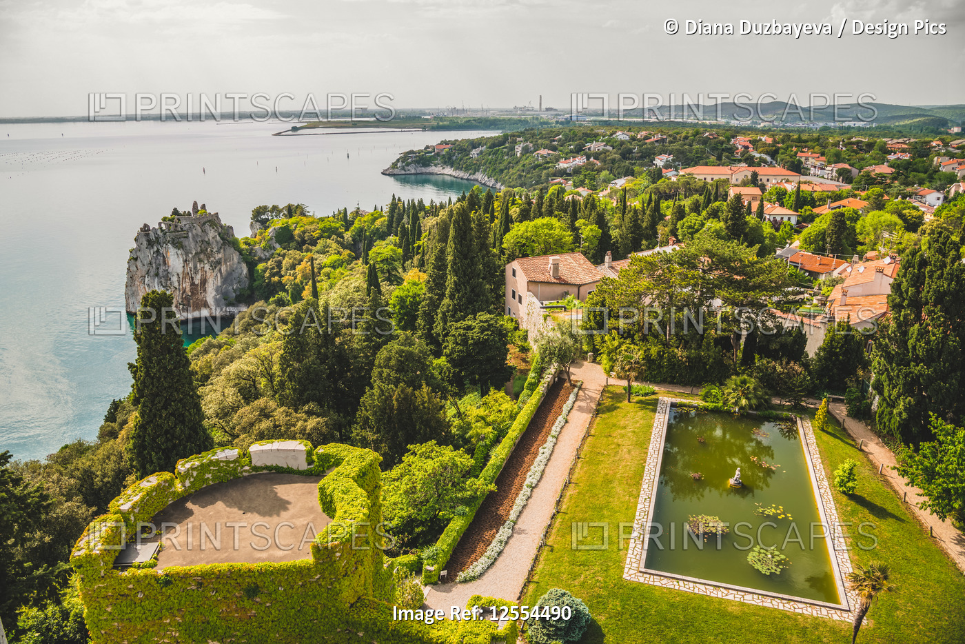 Landscaped grounds of Duino Castle and a view of the coastline of the Gulf of ...