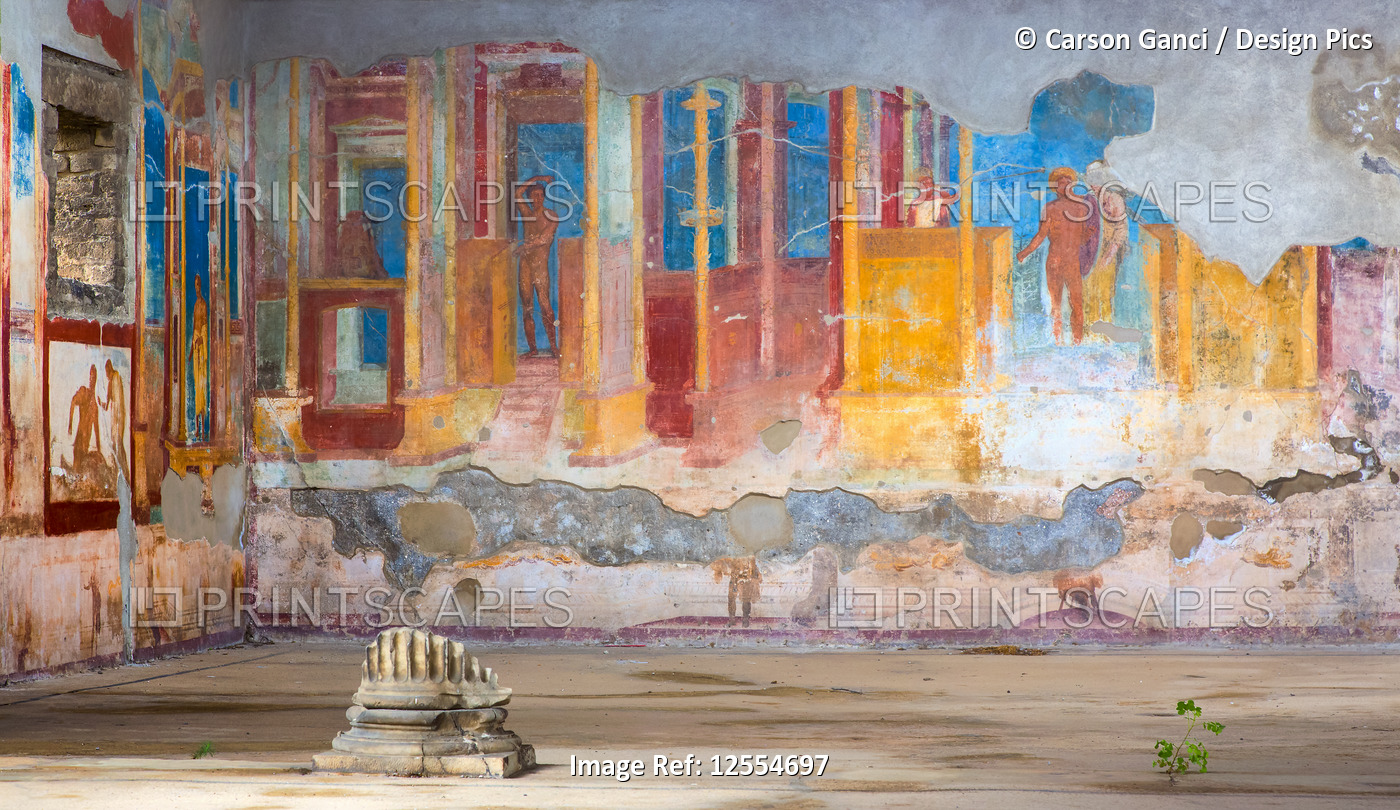 Colourful artwork in peeling layers on walls; Pompeii, Italy