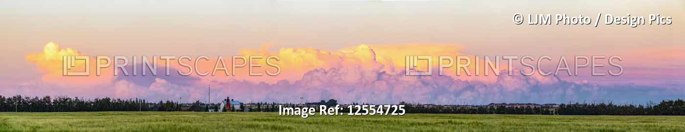 A storm forming at sunset in a rural area outside of St. Albert with huge ...