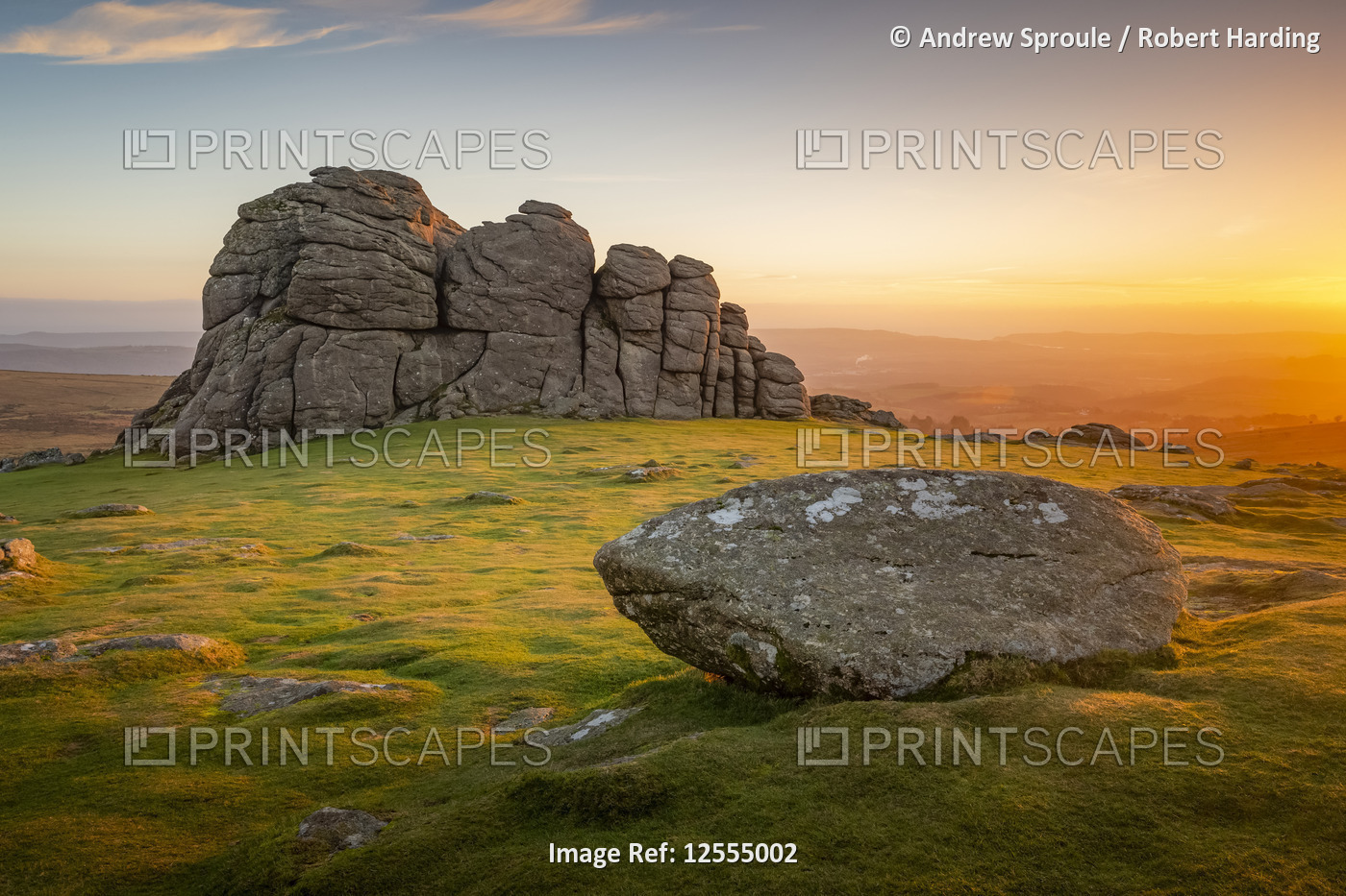 The early morning winter sunrise illuminates the rocks of Haytor, Dartmoor, Devon, England, United K