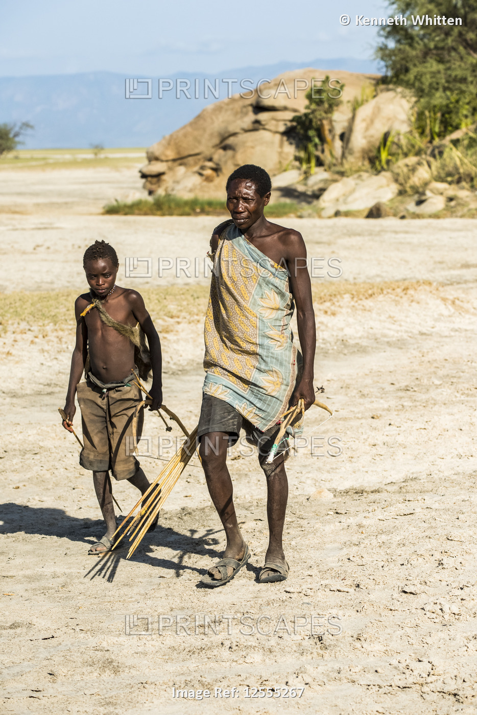 Hadzabe hunters carrying bows and arrows, Tanzania