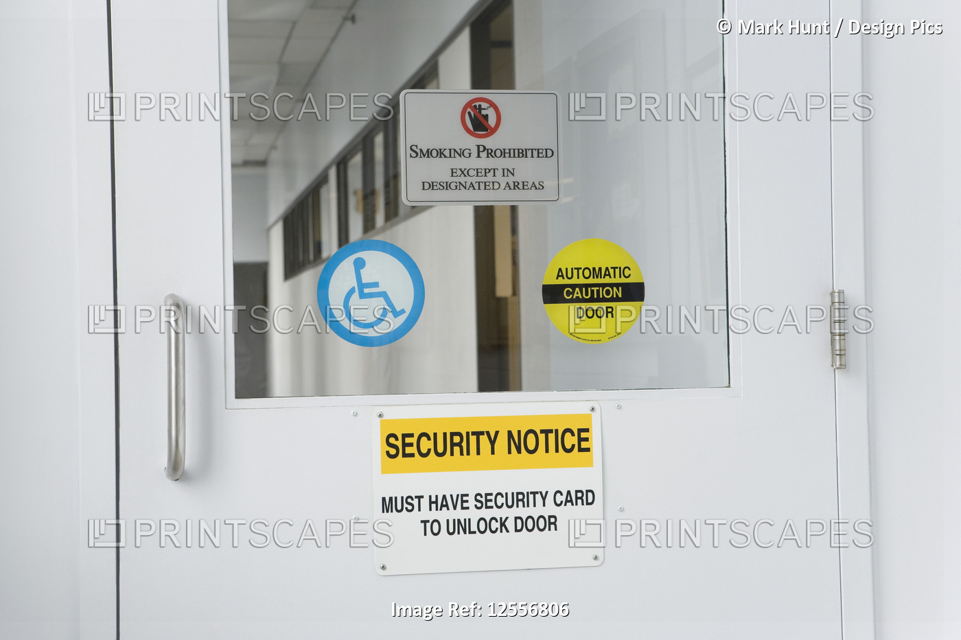 Close-up of information signs on a door of a lab, with disability sign