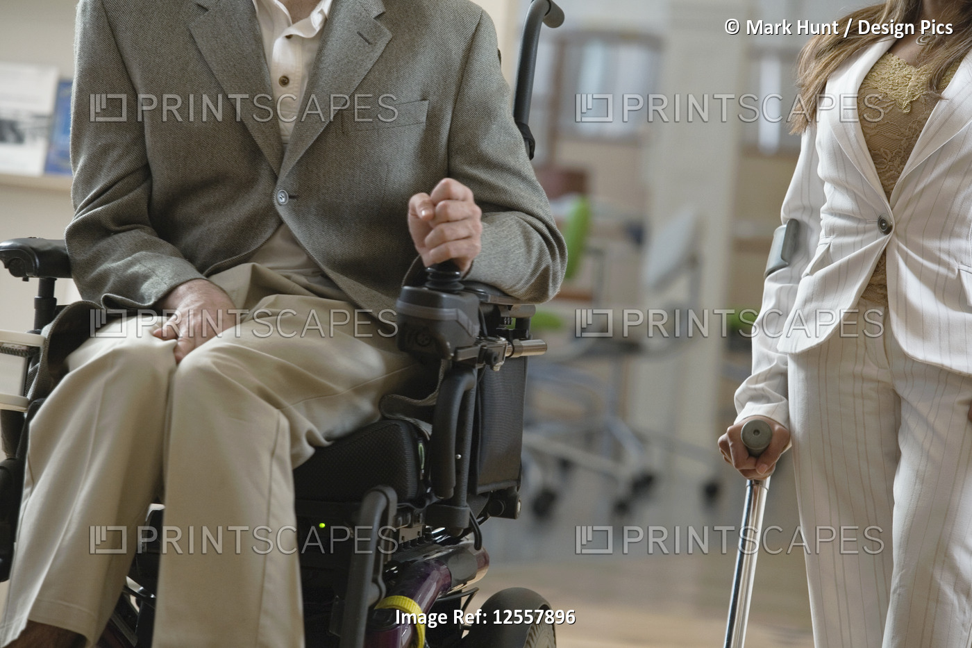 Man with Cerebral Palsy and woman with cane
