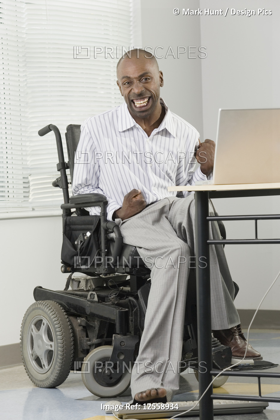 Portrait of a businessman with Cerebral Palsy sitting in a wheelchair and ...