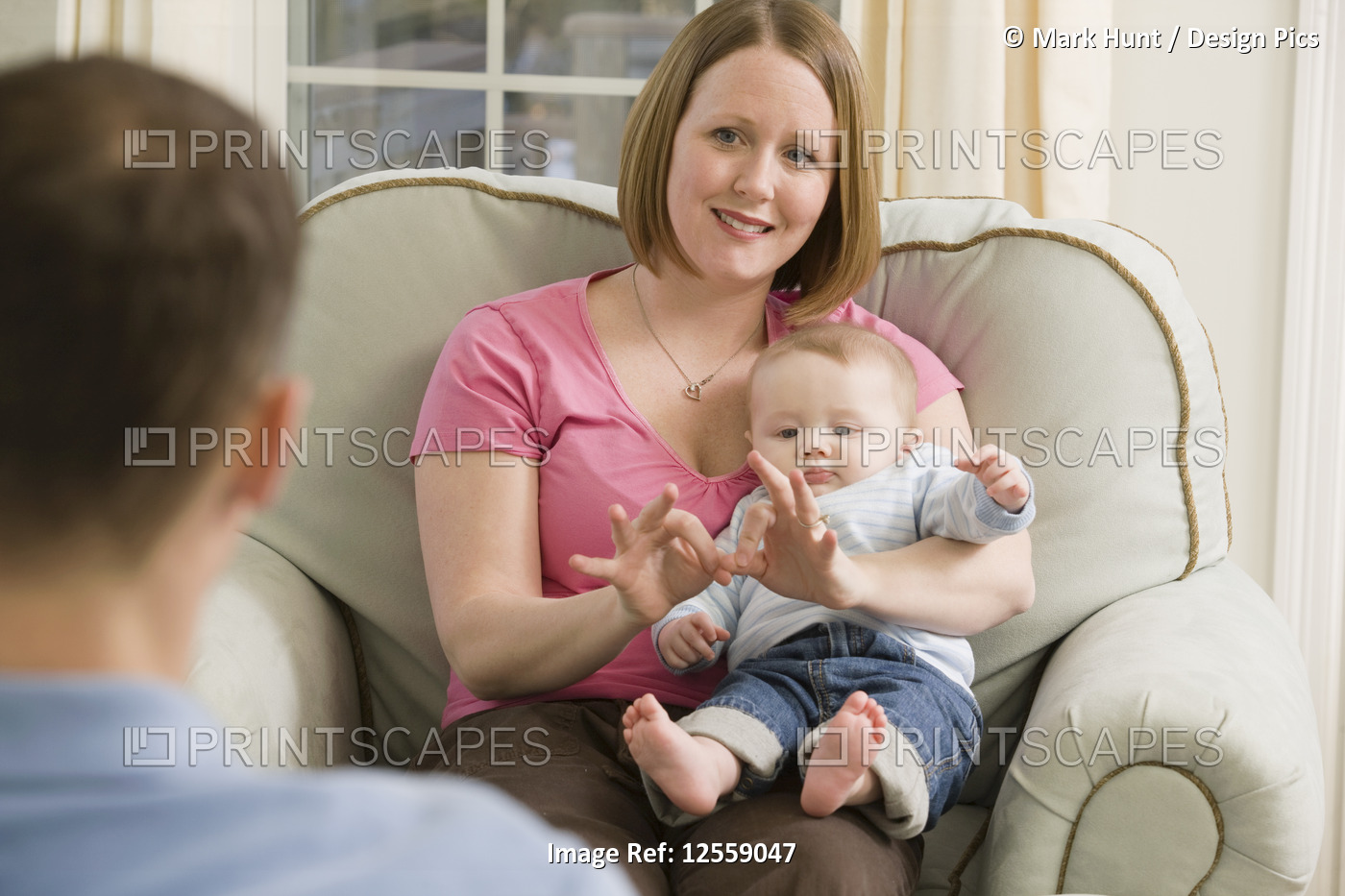 Woman signing the word 'Family' in American sign language while communicating ...