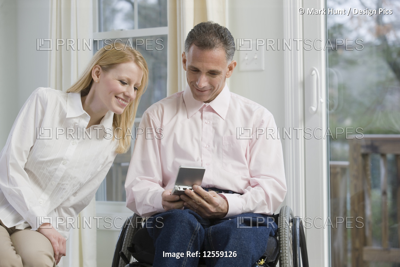 Couple using a personal data assistant