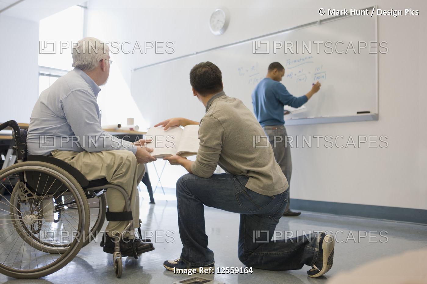 University professor with Muscular Dystrophy teaching his students in a ...