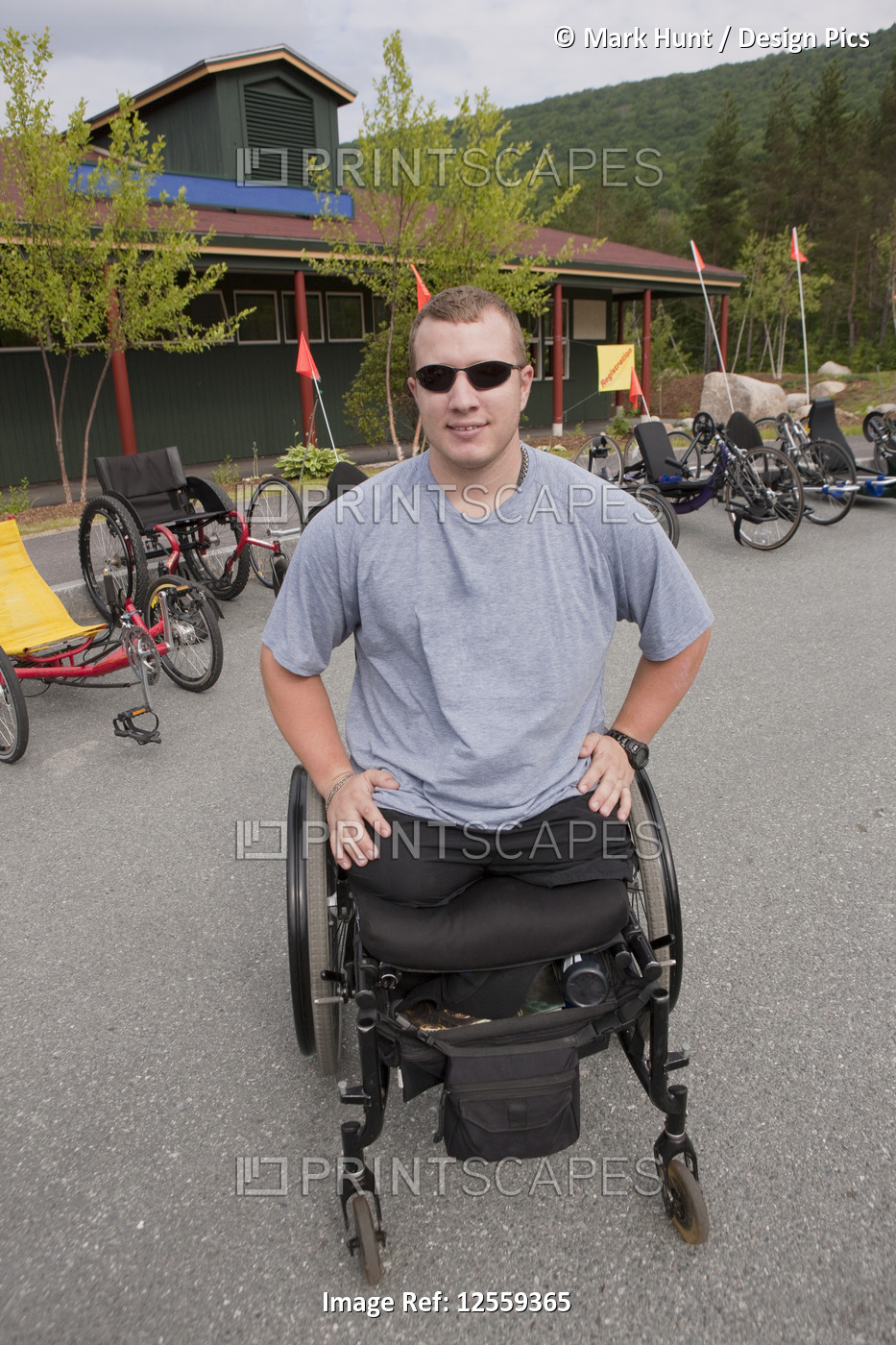 Man with leg amputee in a wheelchair preparing for a race