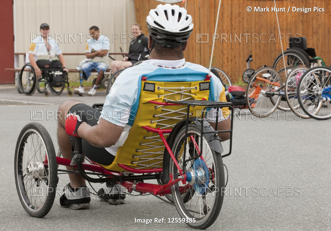Man with spinal cord injury participating in a tricycle race