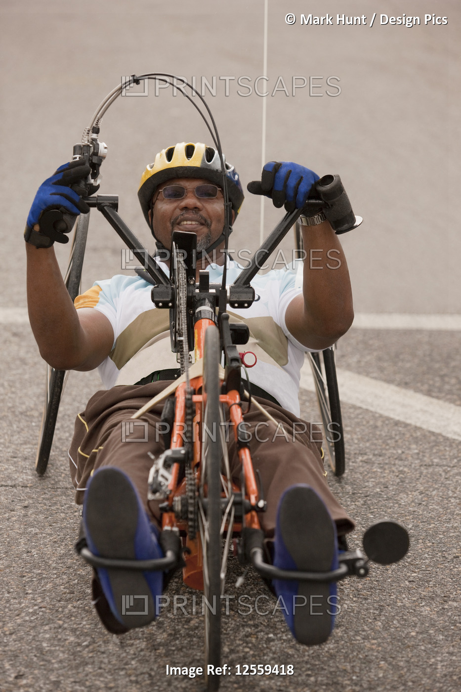 Man with spinal cord injury participating in a bike race