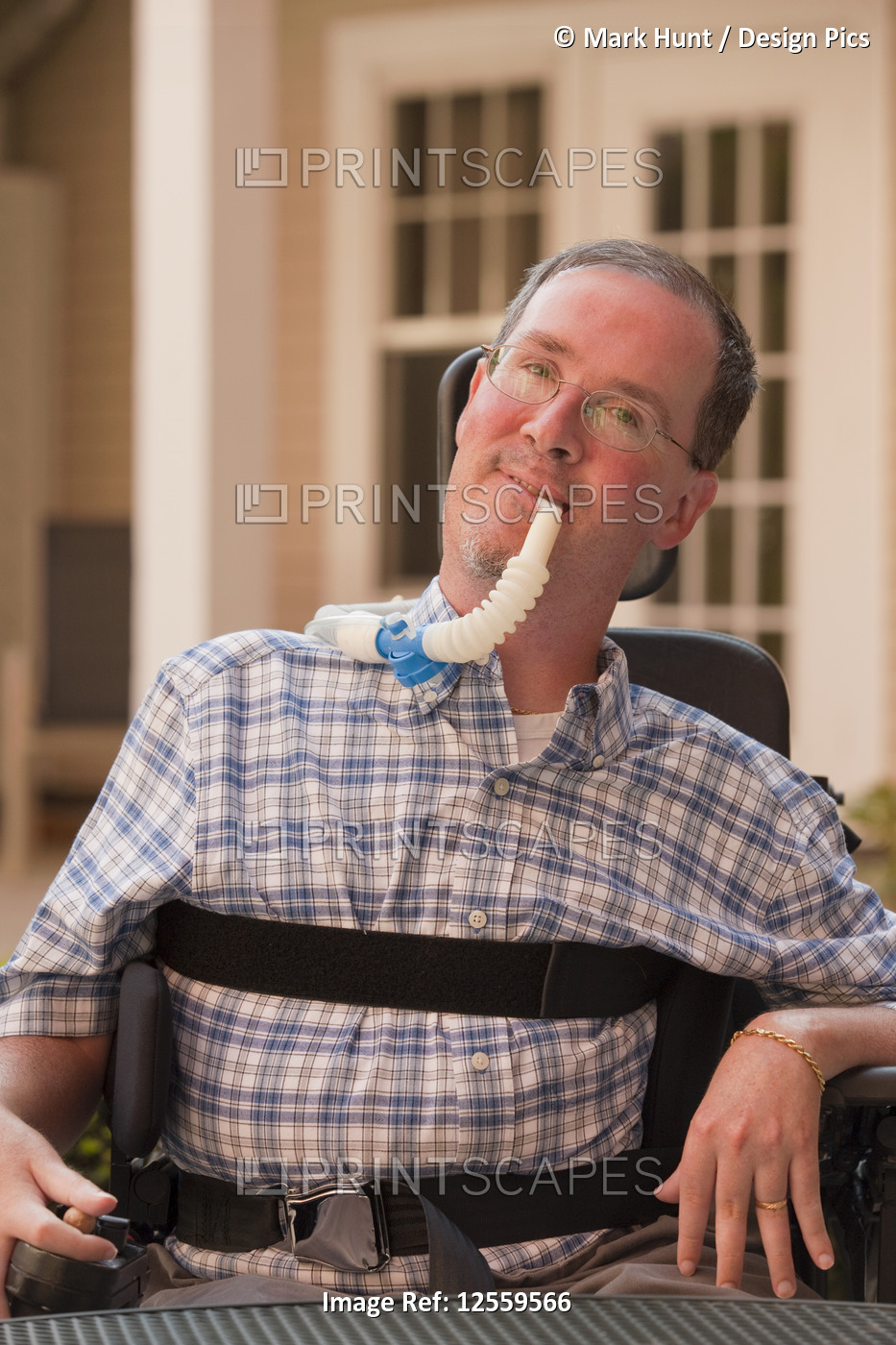 Man with Duchenne muscular dystrophy with a breathing ventilator