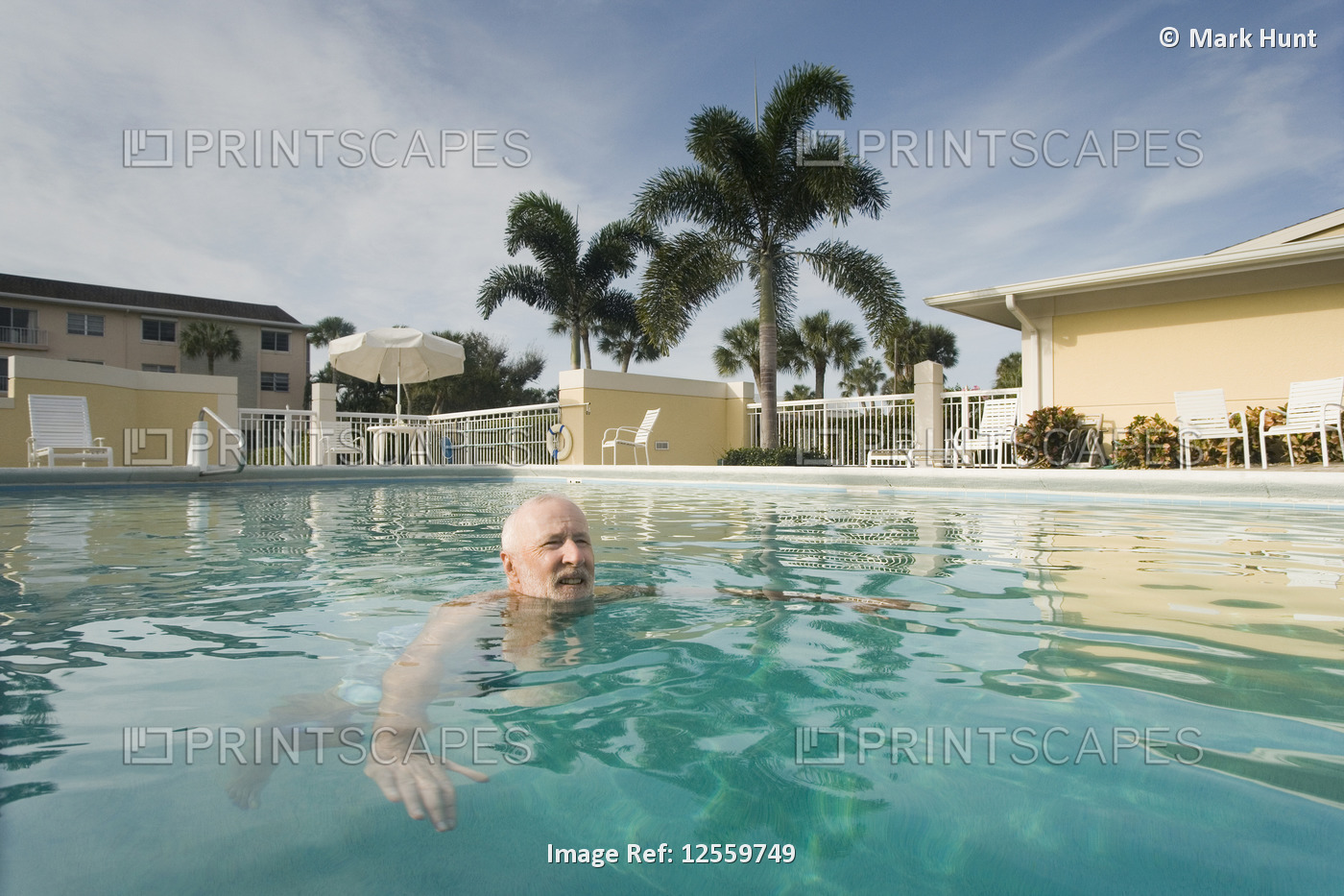 Senior man in a swimming pool, Florida, USA