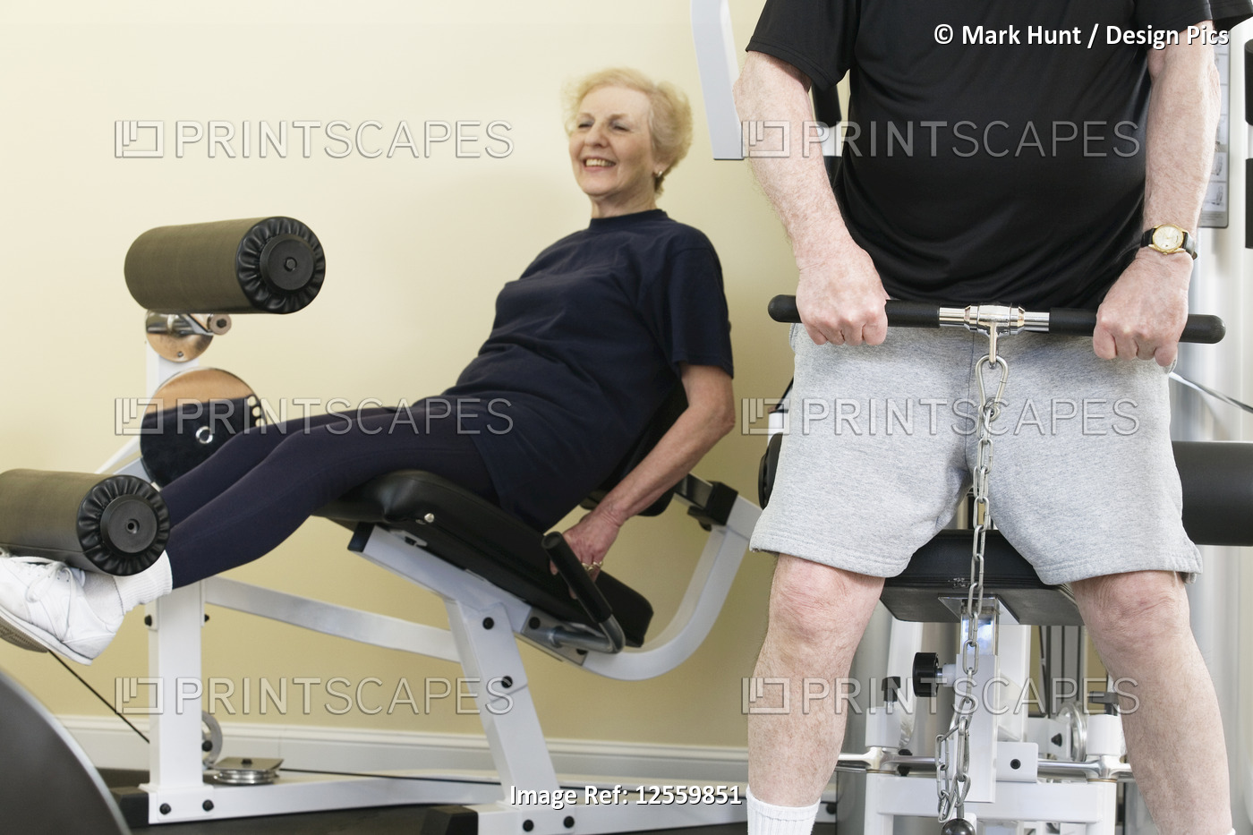 Senior couple exercising in the gym.