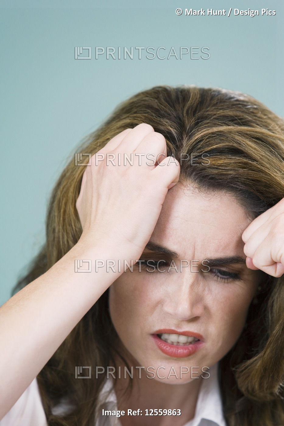 Close-up of a mid adult woman looking depressed - Staged