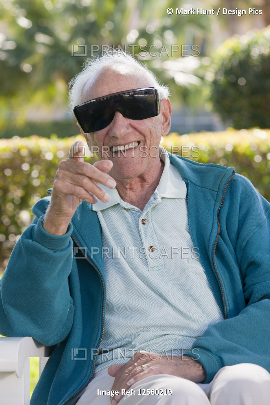 Senior man wearing cataract dark glasses