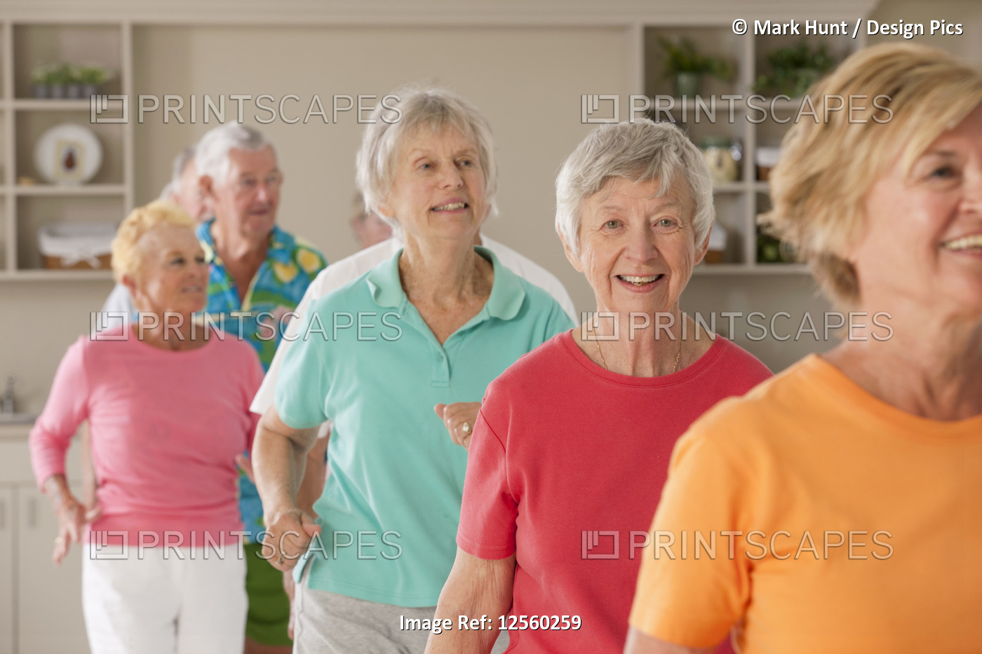 Seniors exercising in a health club