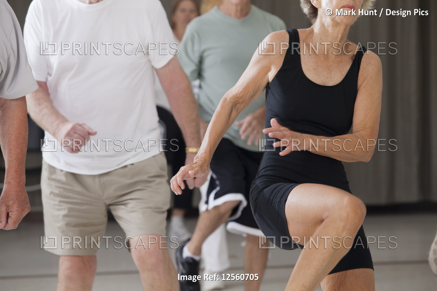 Senior people exercising in an exercising class