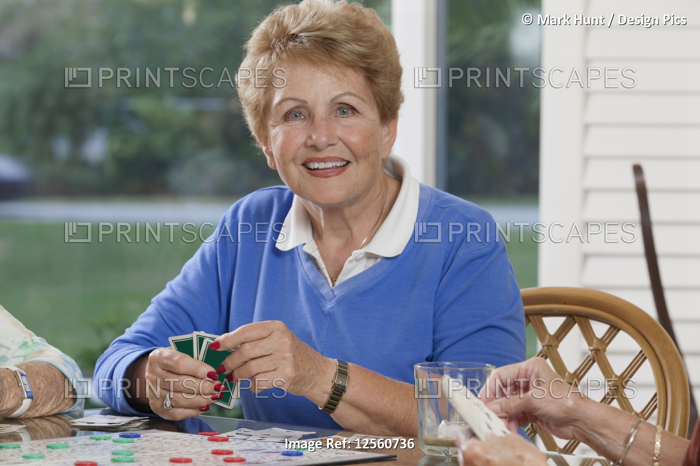 Senior women playing cards
