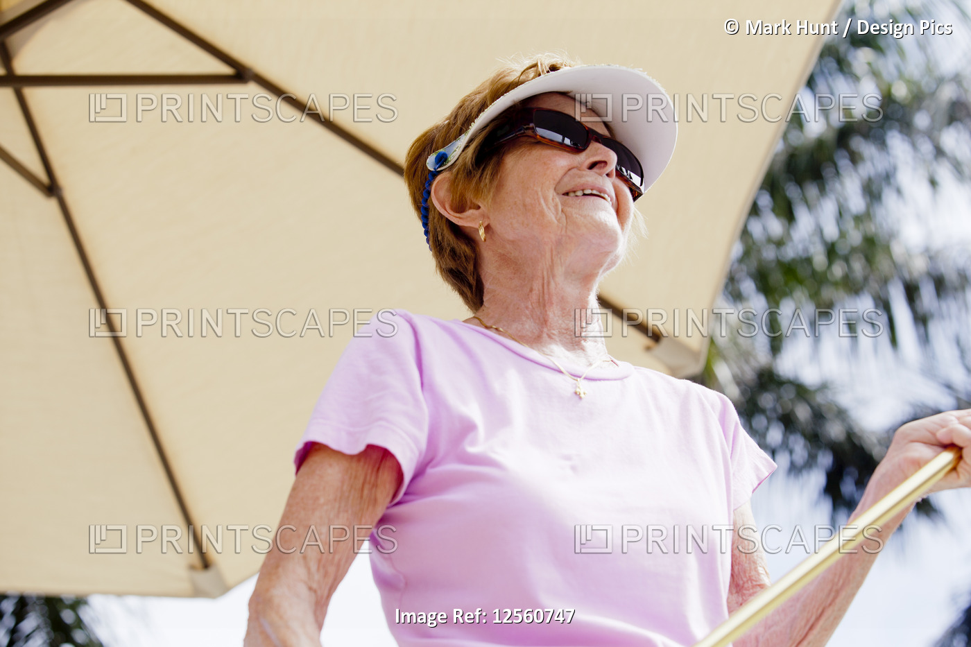 Senior woman at shuffleboard court
