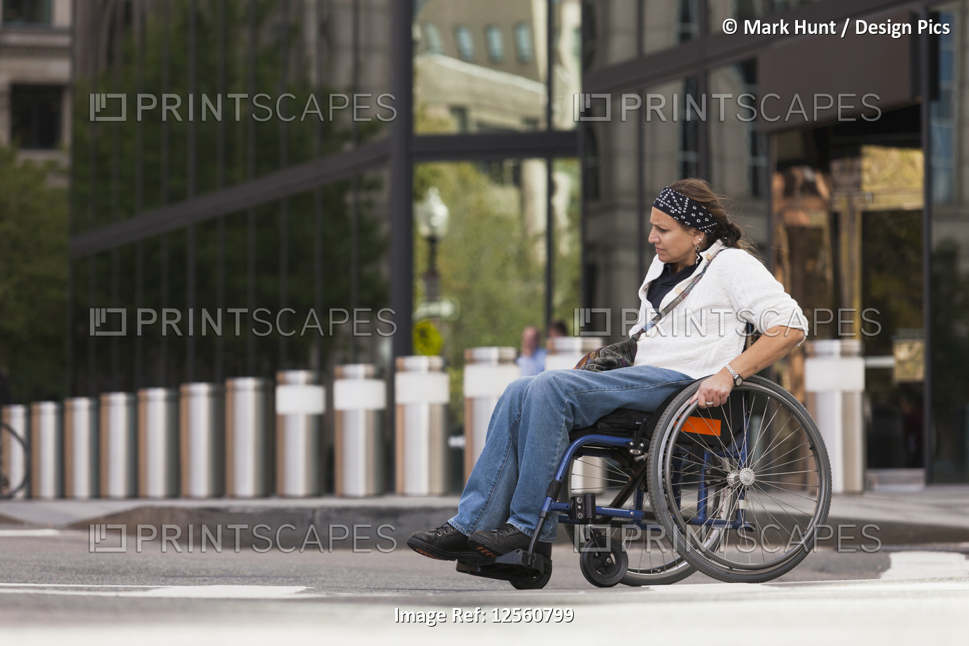 Woman with spinal cord injury crossing street, Boston, Massachusetts, USA