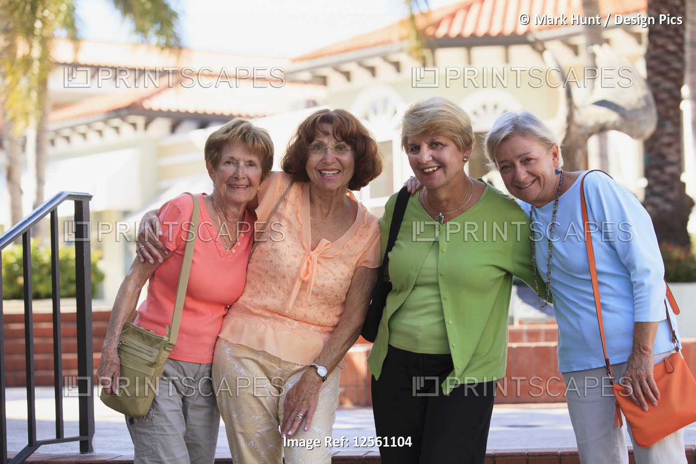 Four senior friends smiling