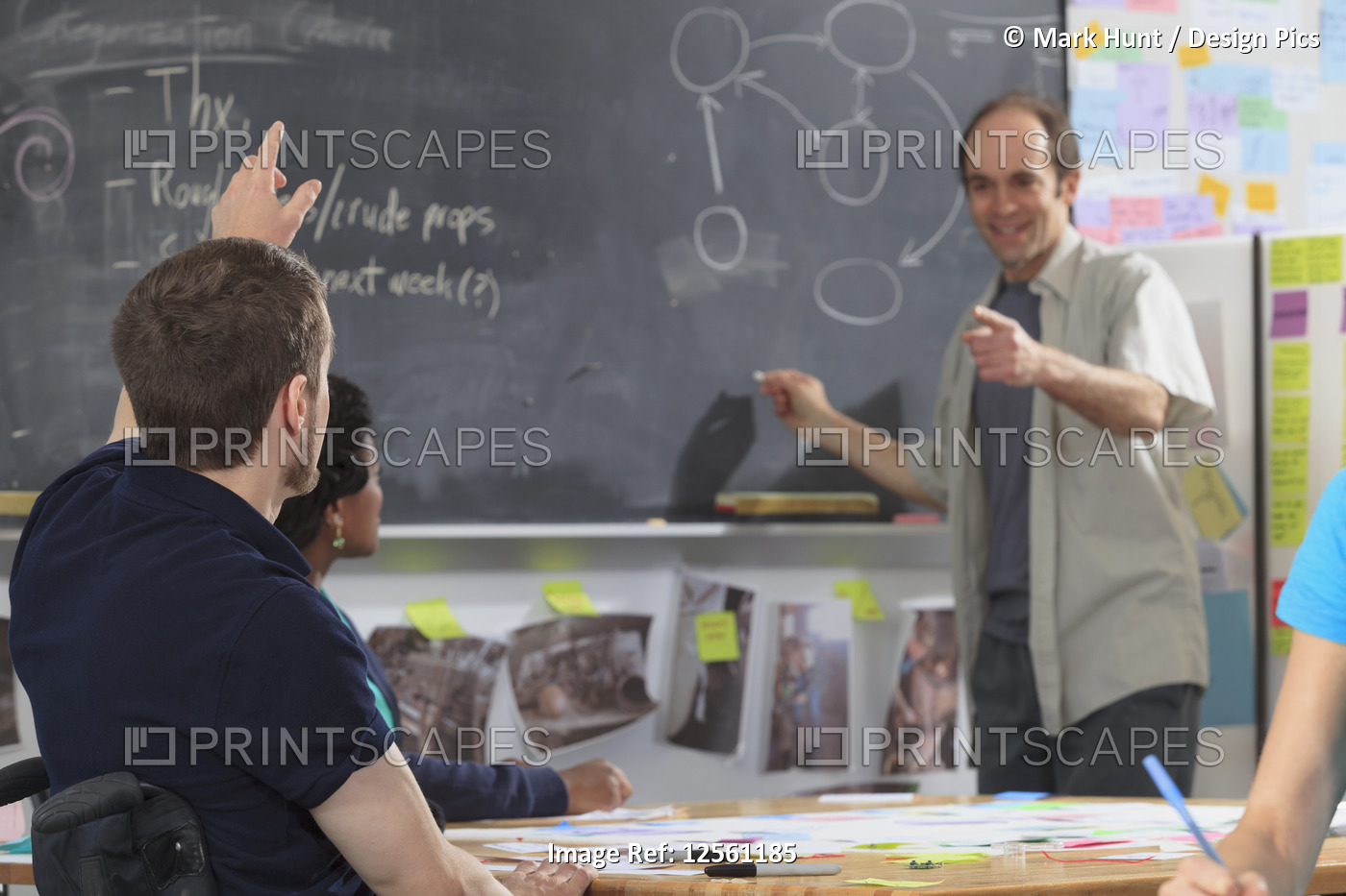 Engineering instructor with Aspergers demonstrating project bubble diagram to ...