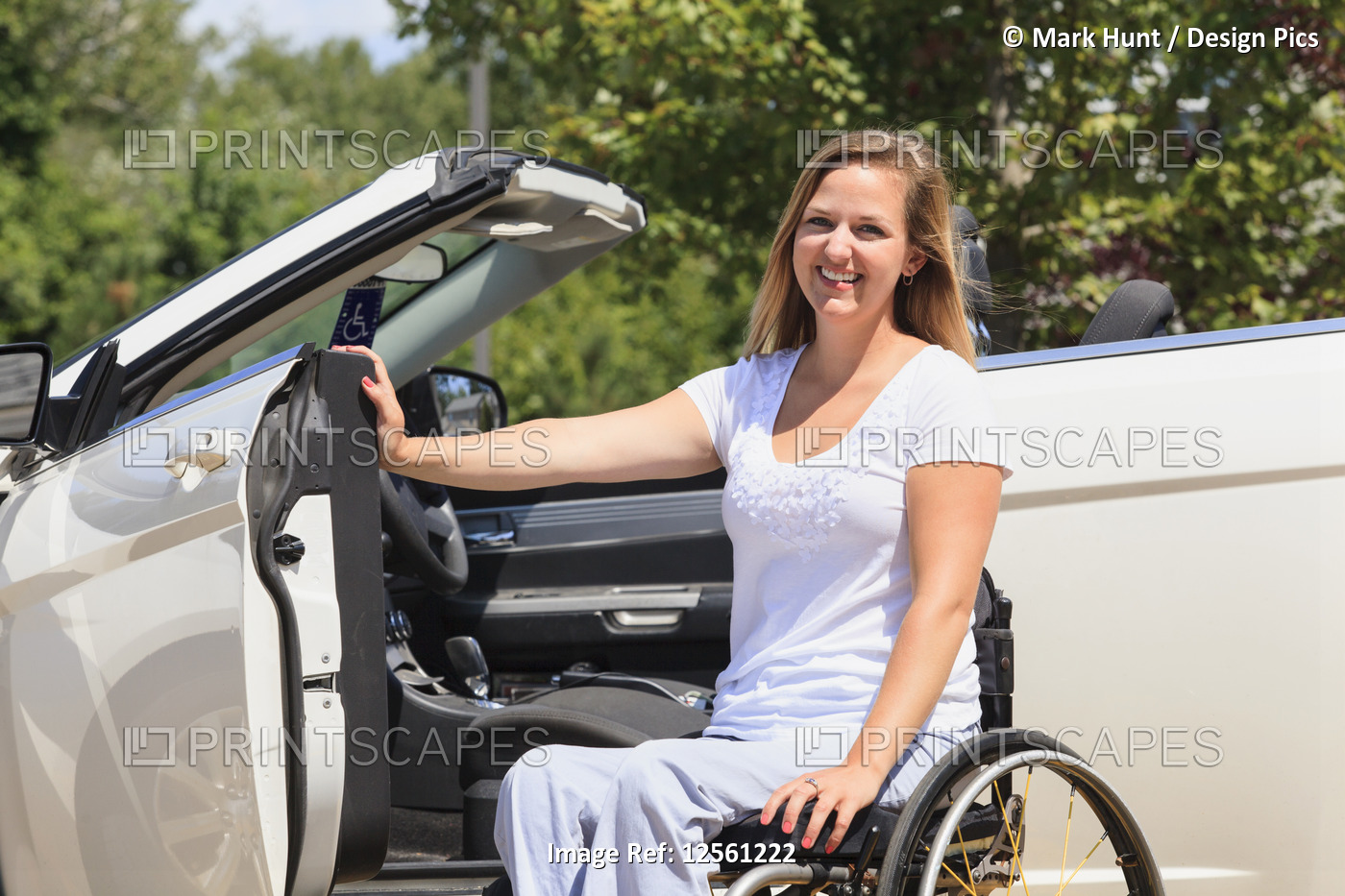 Woman with a spinal cord injury in her wheelchair and getting into her adaptive ...
