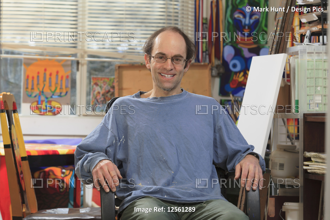 Man with Asperger's sitting in his art studio