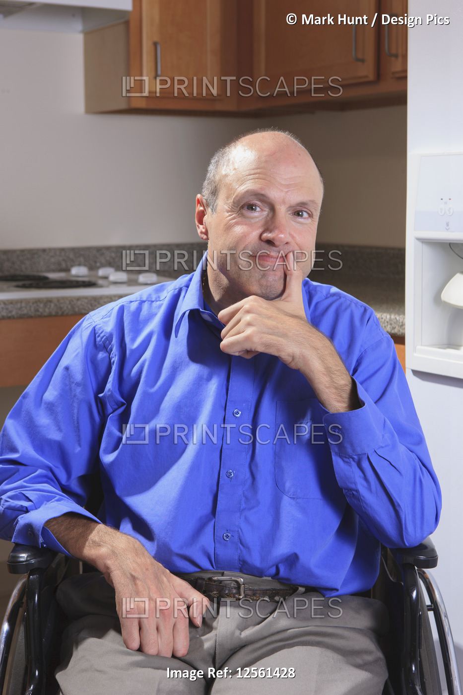 Man with Friedreich's Ataxia and deformed hands sitting in his wheelchair and ...