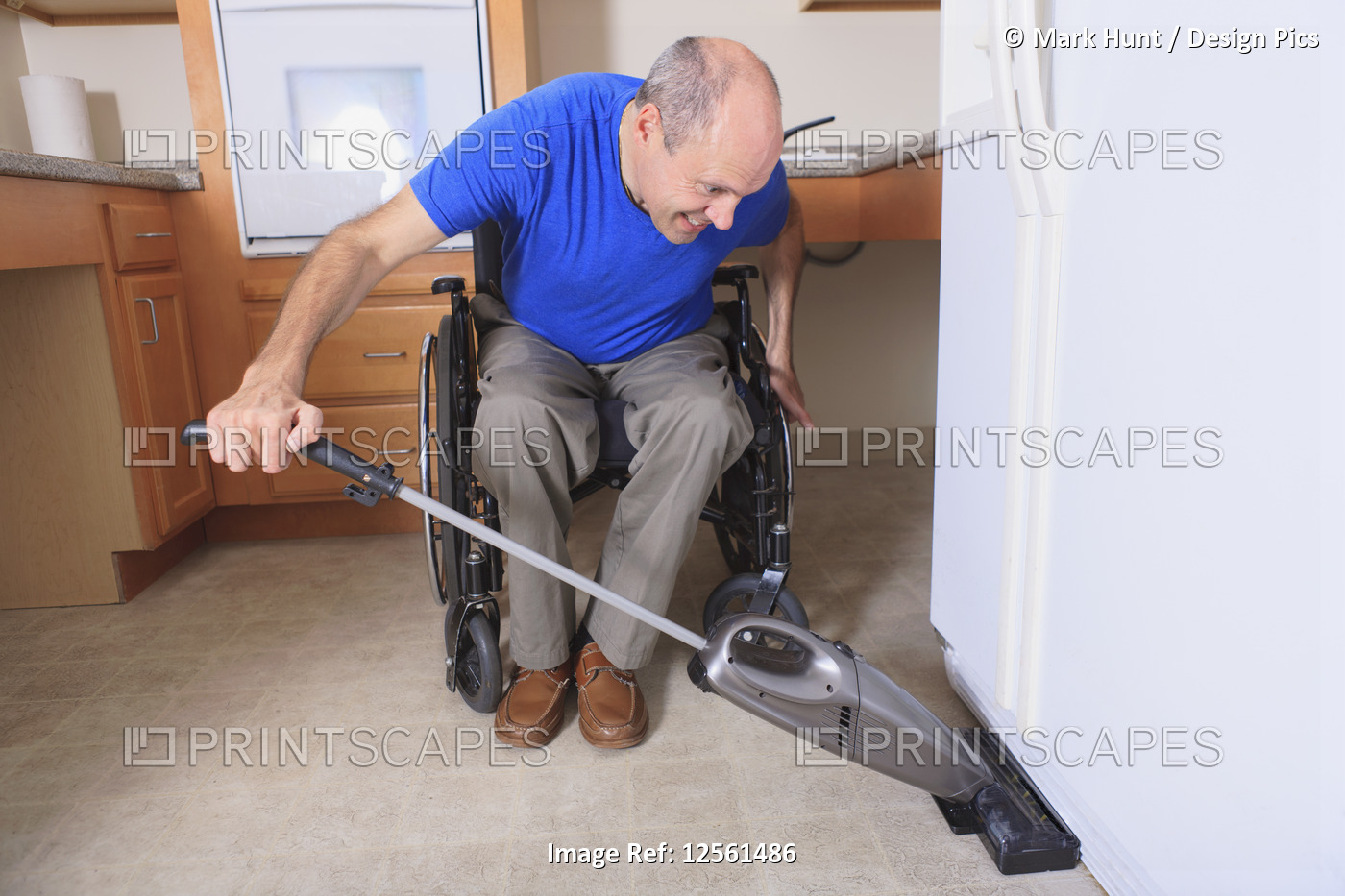 Man with Friedreich's Ataxia and deformed hands vacuuming his house from his ...