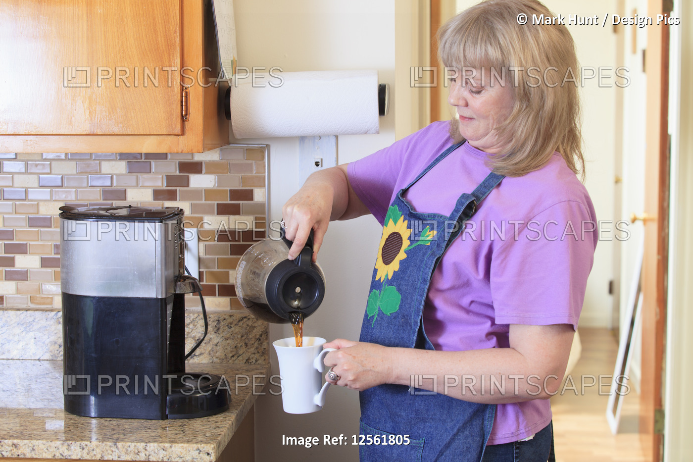 Woman with Bipolar disorder living at home and making coffee