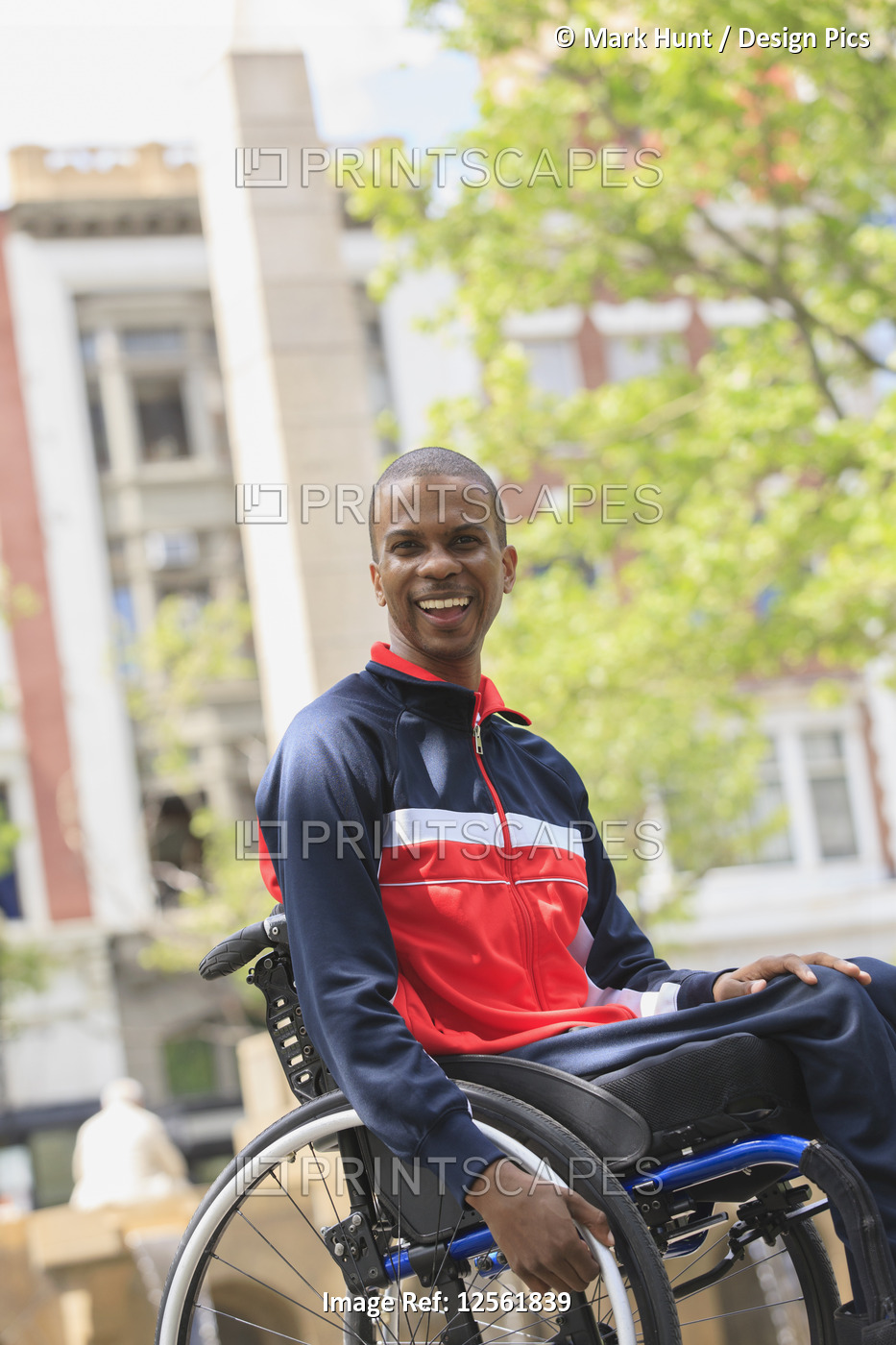 Man in wheelchair who had  Spinal Meningitis moving independently in the city