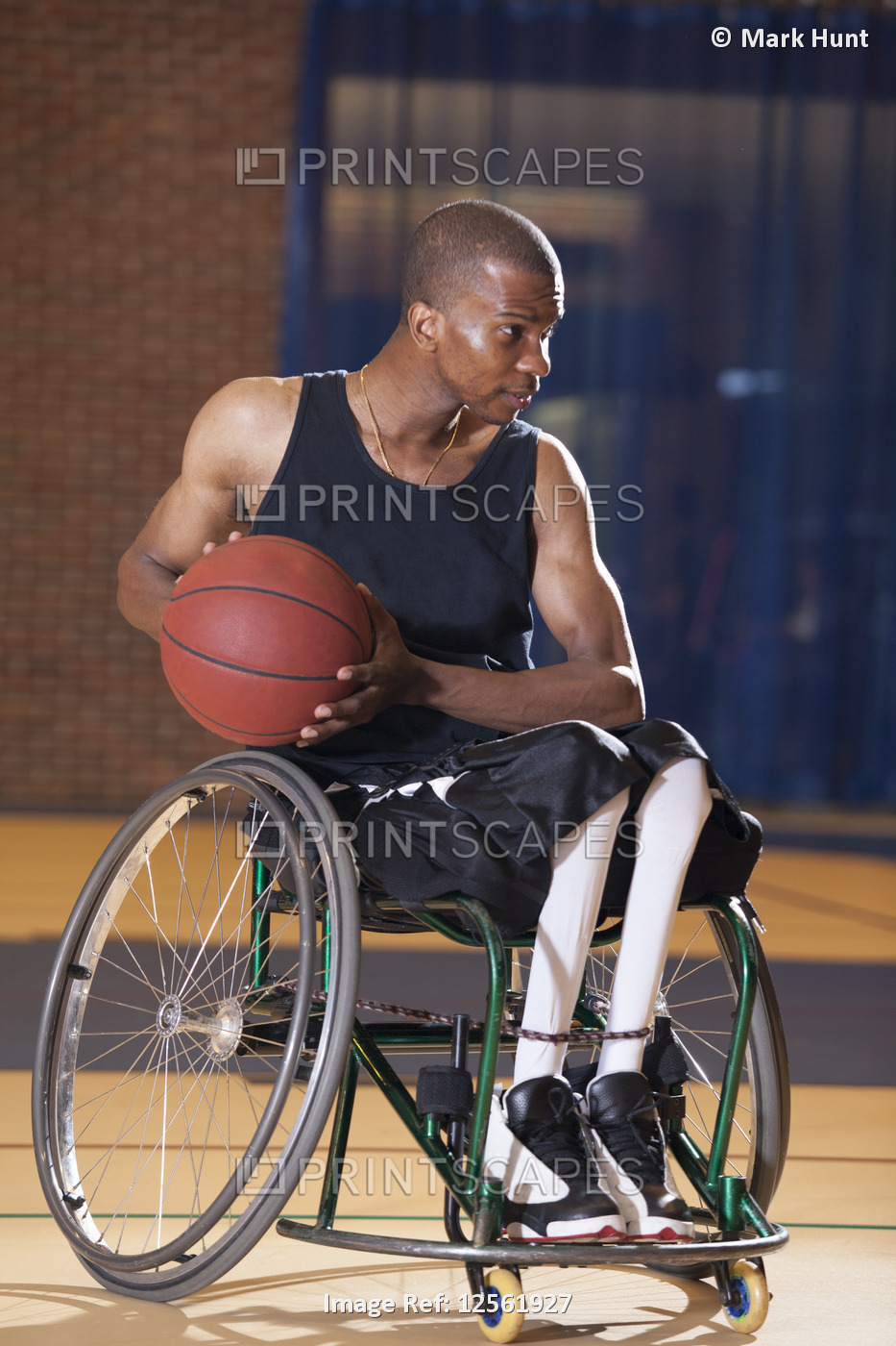 Man who had Spinal Meningitis in wheelchair passing basketball