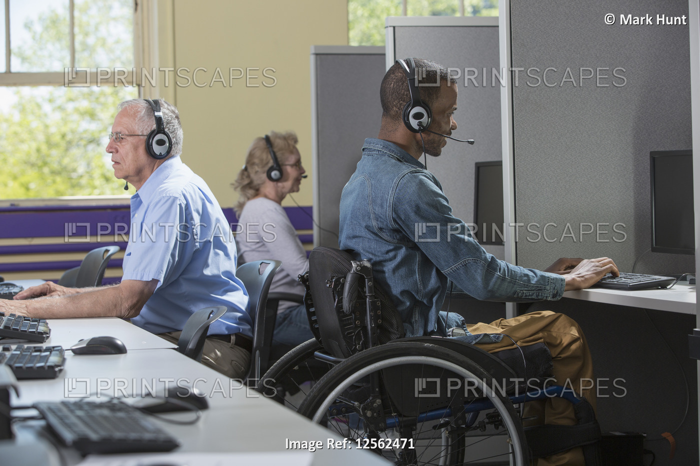 Man  who had Spinal Meningitis in a wheelchair working at a Call Center