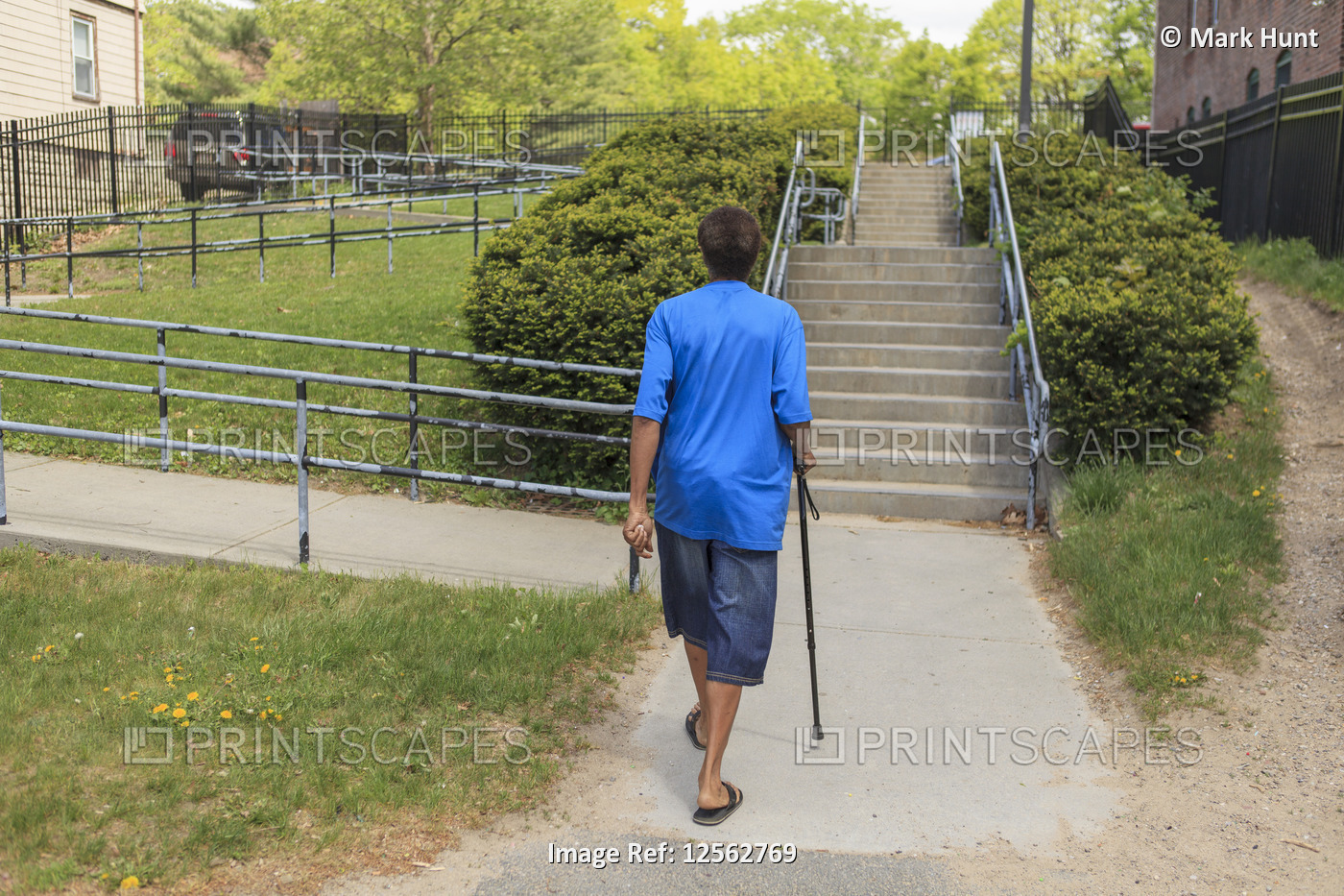 Man with Traumatic Brain Injury walking in his neighborhood
