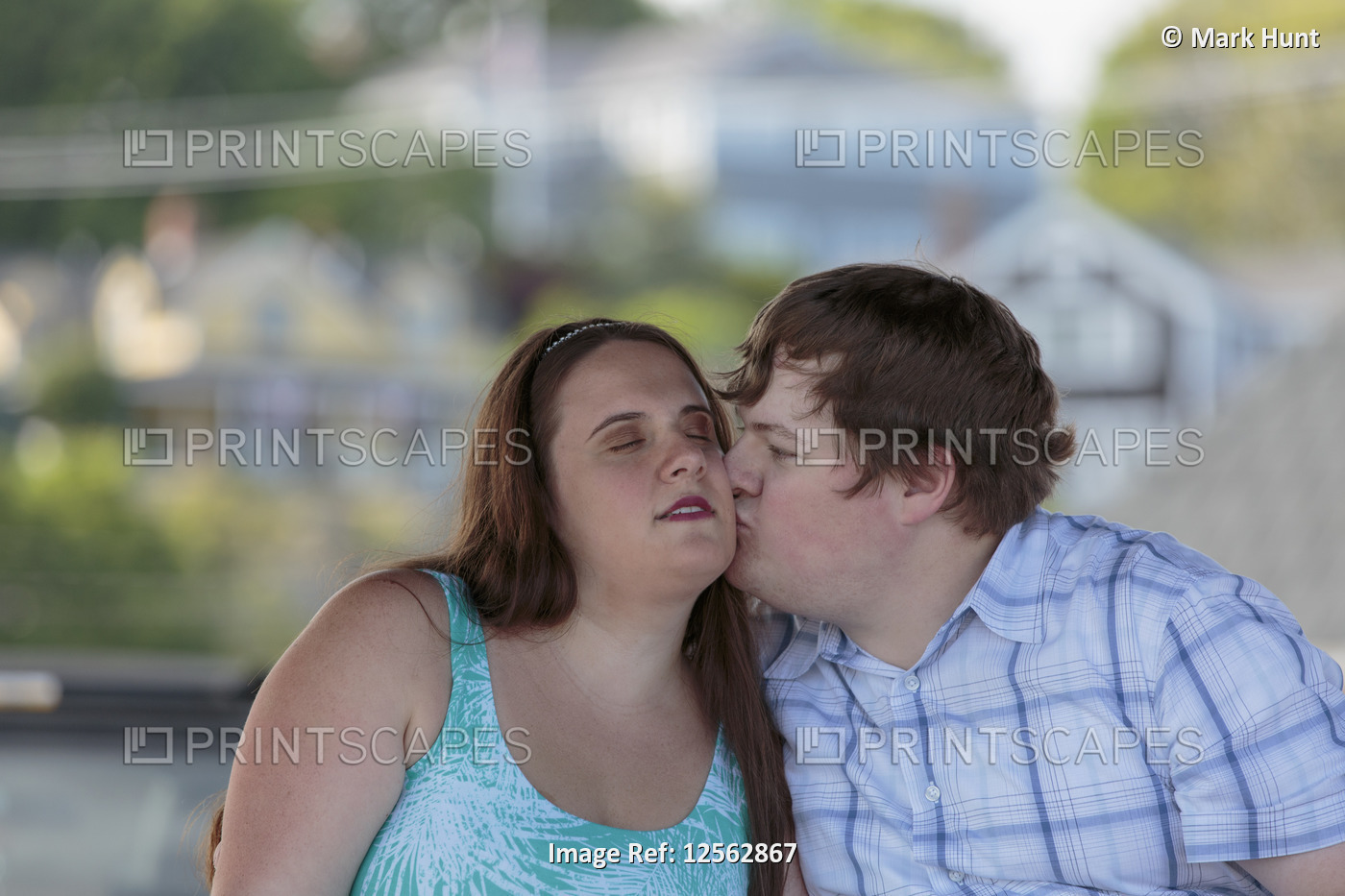 Blind man kissing his blind fiance