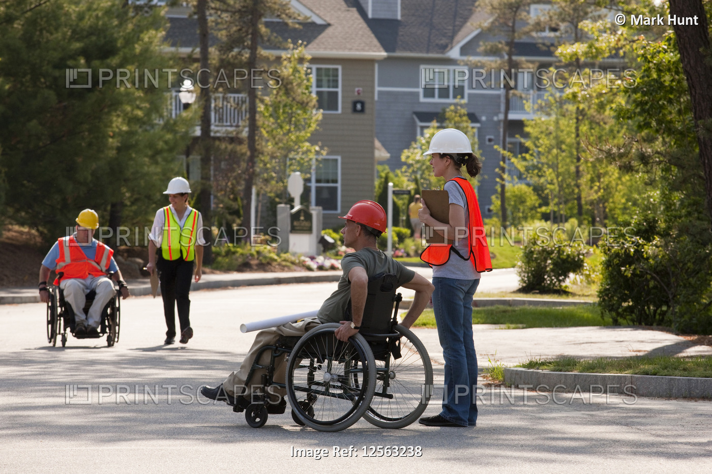 Project engineers with Spinal Cord Injuries inspecting finished building ...
