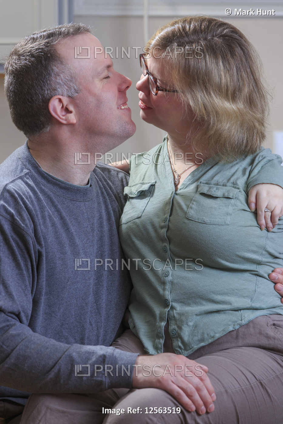 Woman with TAR Syndrome about to kiss her husband