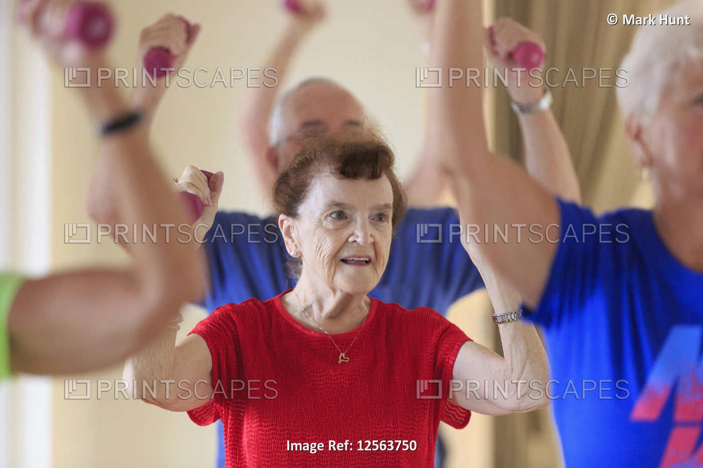 Senior people exercising in gym