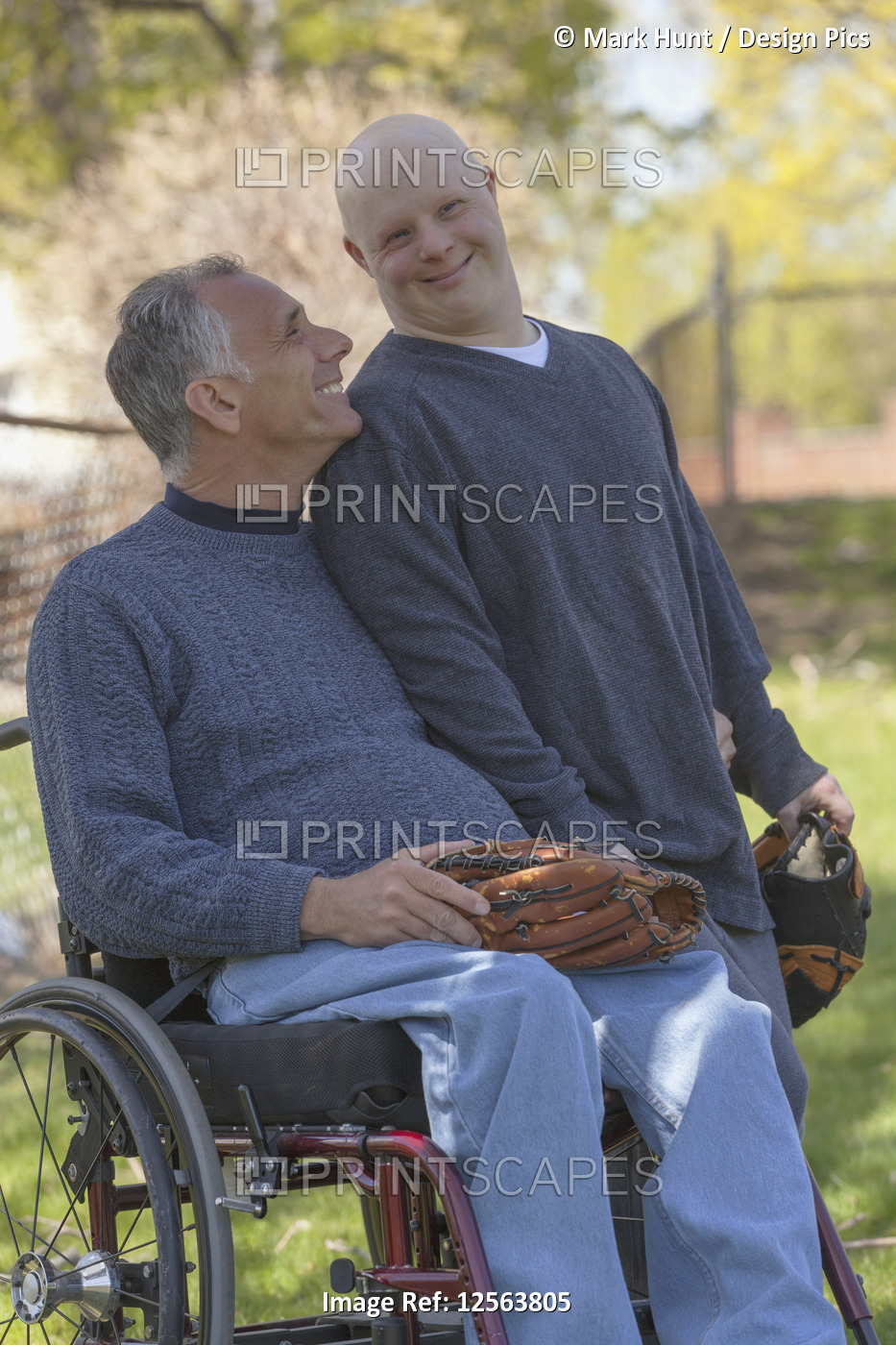 Happy father with Spinal Cord Injury and his son with Down Syndrome about to ...