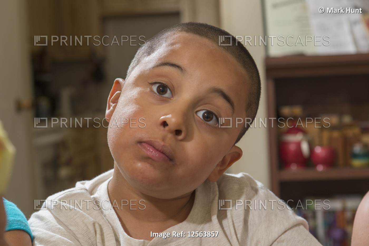 Portrait of Hispanic boy with Autism at home
