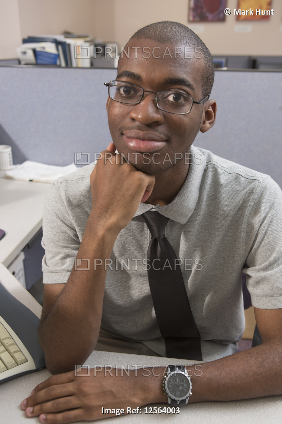 Portrait of African American man with Autism working in an office
