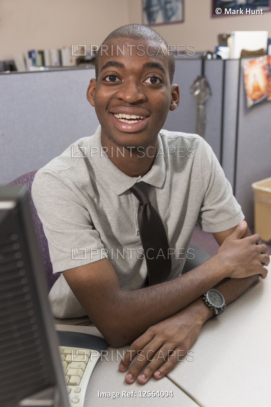 Portrait of happy African American man with Autism working in an office