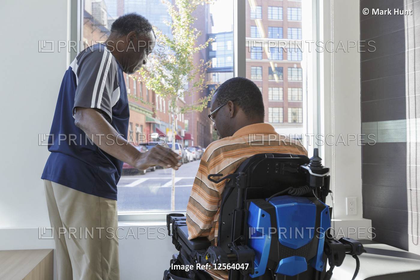 Man with Guillain-Barre Syndrome with his father looking out through the ...