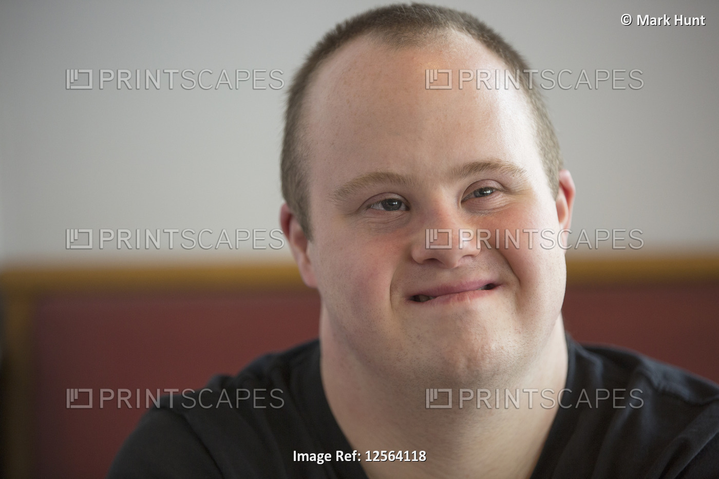 Portrait of waiter with Down Syndrome in a restaurant