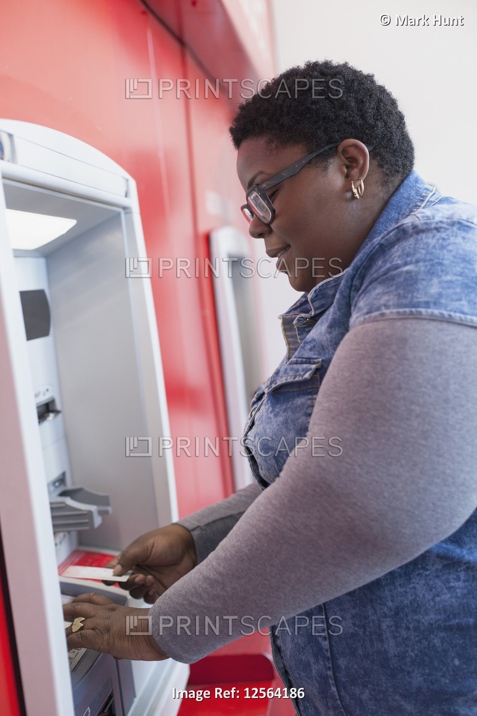Happy woman with bipolar disorder doing a bank withdrawal