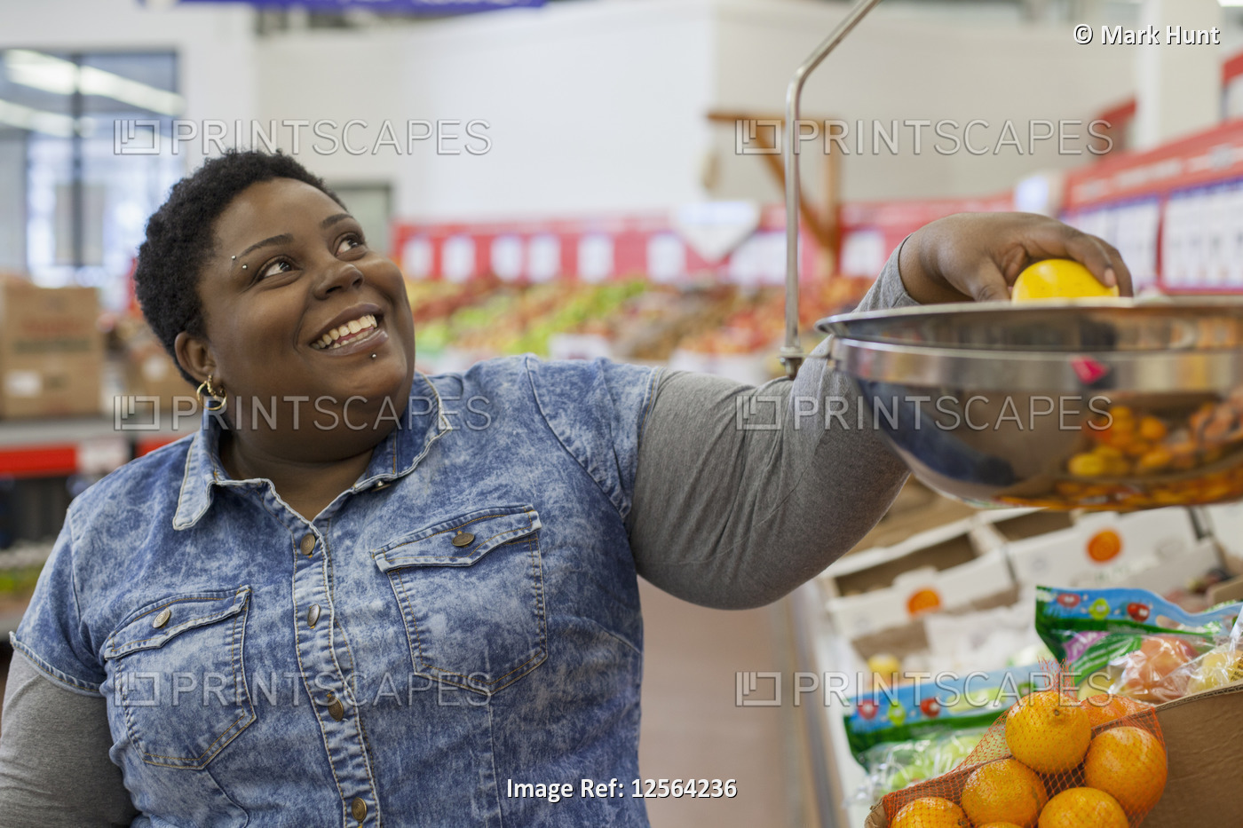 Happy woman with bipolar disorder weighing food